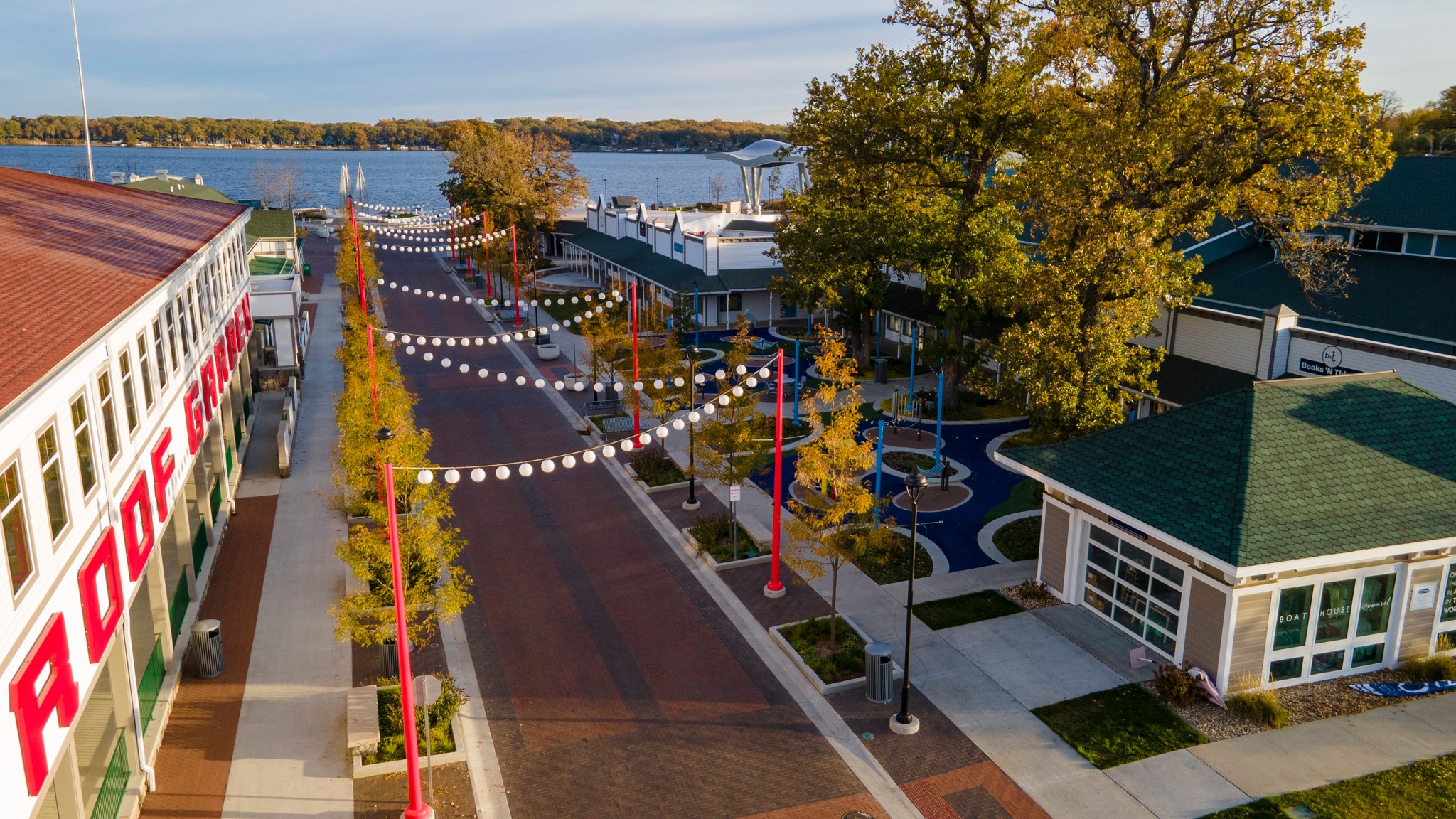 Aerial view of Lake Street in Arnolds Park, Iowa, featuring reconstructed streetscape, brick paving, landscaping, and pedestrian areas.